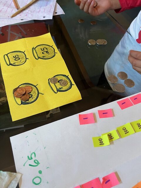 student counting money during tutoring lesson